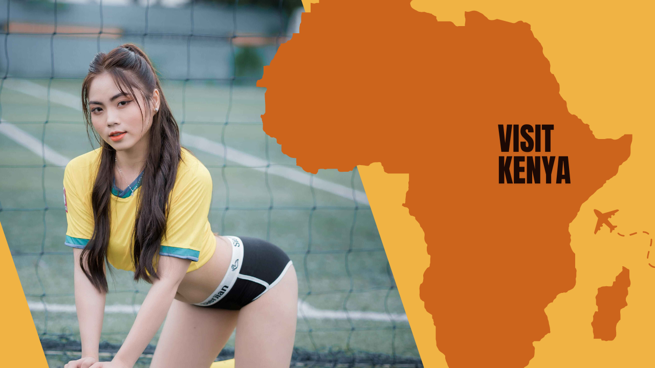 A young woman in a soccer jersey holding a football by a soccer goal